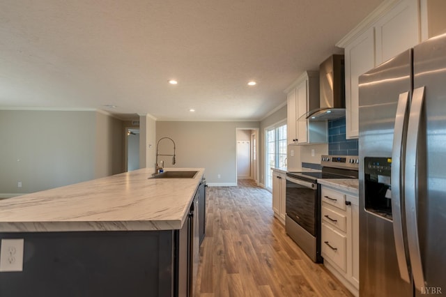 1381 Moccasin Path Trl, Huddleston, VA 24104 - kitchen featuring wall chimney range hood, a large island with sink, a sink, light wood finished floors, and stainless steel appliances