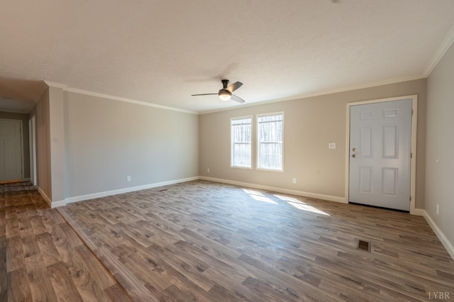 1381 Moccasin Path Trl, Huddleston, VA 24104 - spare room featuring ceiling fan, visible vents, wood finished floors, baseboards, and ornamental molding