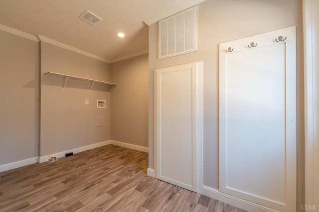 1381 Moccasin Path Trl, Huddleston, VA 24104 - washroom featuring washer hookup, visible vents, ornamental molding, and light wood finished floors