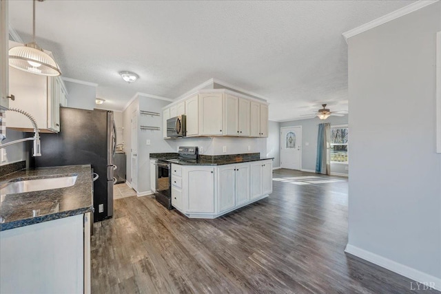 1309 Gate Ln, Moneta, VA 24121 - kitchen featuring range with electric cooktop, dark countertops, a ceiling fan, and ornamental molding