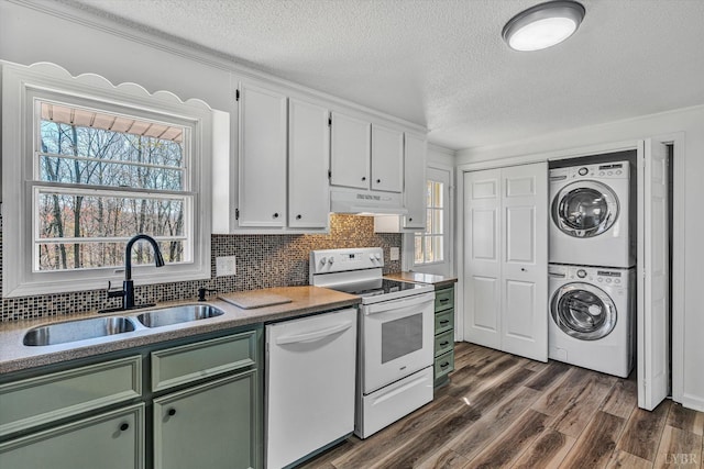 1330 Springfield Dr, Vinton, VA 24179 - kitchen with white appliances, green cabinets, a sink, stacked washing machine and dryer, and under cabinet range hood
