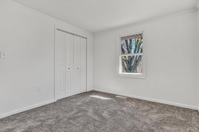 1330 Springfield Dr, Vinton, VA 24179 - unfurnished bedroom featuring carpet, crown molding, a textured ceiling, a closet, and baseboards