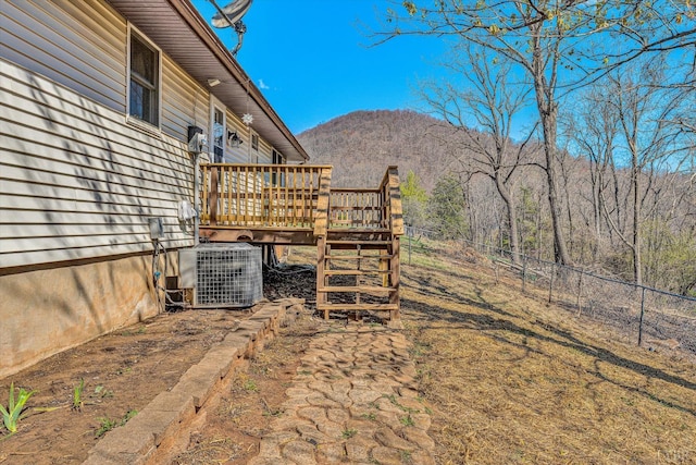 1330 Springfield Dr, Vinton, VA 24179 - fenced backyard with a deck with mountain view, central air condition unit, and stairway