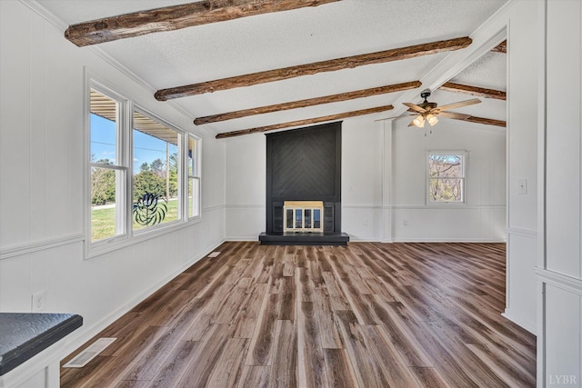1330 Springfield Dr, Vinton, VA 24179 - unfurnished living room featuring a large fireplace, wood finished floors, ceiling fan, a decorative wall, and a textured ceiling