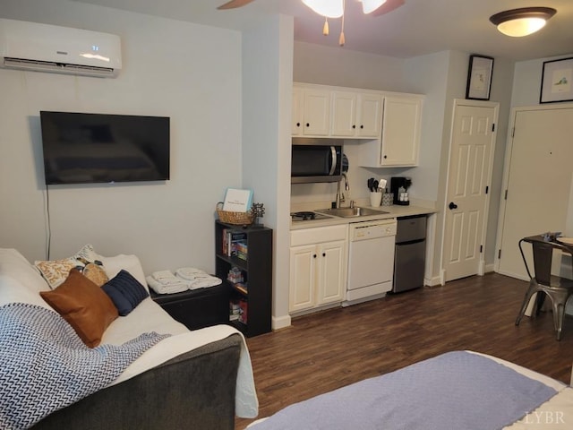1245 Graves Harbor Dr Unit 2103, Huddleston, VA 24104 - kitchen with a sink, dishwasher, dark wood finished floors, stainless steel microwave, and an AC wall unit