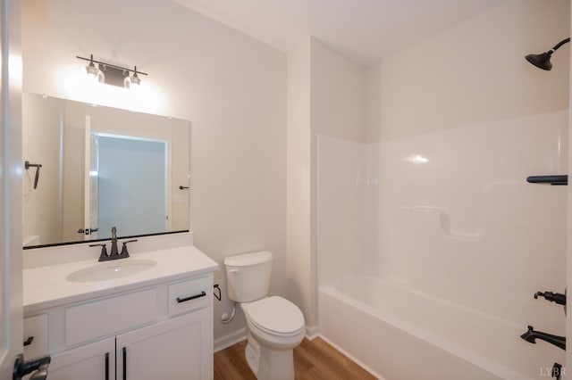 128 Brenleigh Ct Unit 102, Lynchburg, VA 24501 - full bath featuring wood finished floors, vanity, toilet, shower / tub combination, and baseboards