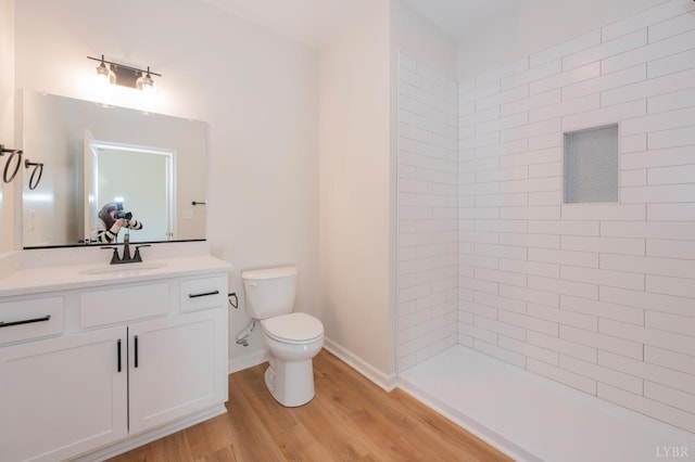 128 Brenleigh Ct Unit 102, Lynchburg, VA 24501 - full bath with vanity, toilet, wood finished floors, and a tile shower