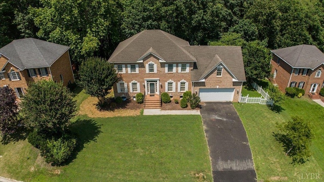 352 Wild Turkey Rd, Lynchburg, VA 24502 - view of front facade featuring asphalt driveway, brick siding, and a garage