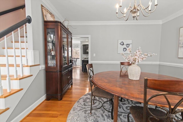 352 Wild Turkey Rd, Lynchburg, VA 24502 - dining space featuring crown molding, light wood-style floors, stairs, and a chandelier
