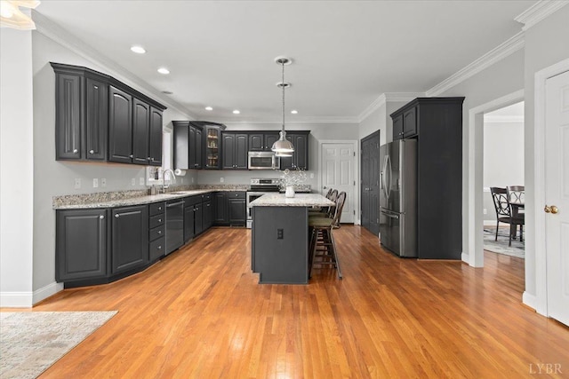 352 Wild Turkey Rd, Lynchburg, VA 24502 - kitchen with stainless steel appliances, light wood-style floors, a breakfast bar, recessed lighting, and crown molding
