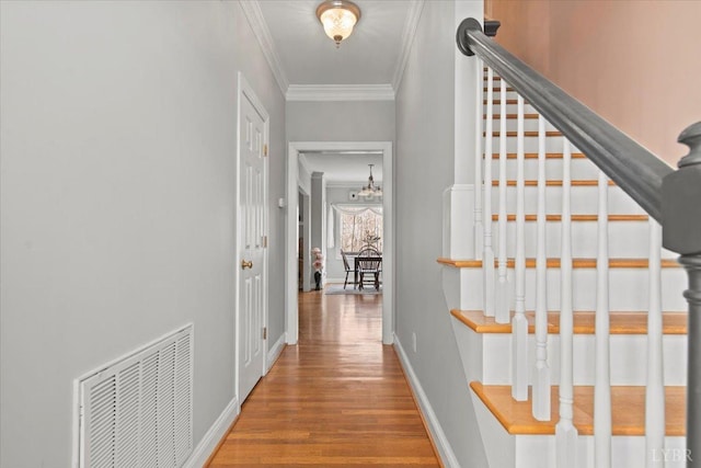 352 Wild Turkey Rd, Lynchburg, VA 24502 - hall with crown molding, wood finished floors, stairs, and a chandelier