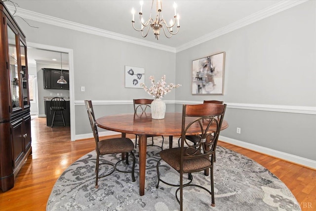 352 Wild Turkey Rd, Lynchburg, VA 24502 - dining area with a chandelier, light wood-style flooring, and ornamental molding