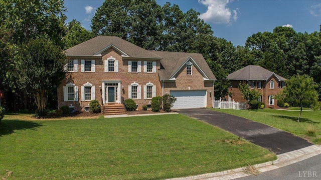 352 Wild Turkey Rd, Lynchburg, VA 24502 - colonial home with asphalt driveway, brick siding, and a garage
