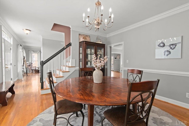 352 Wild Turkey Rd, Lynchburg, VA 24502 - dining space featuring a chandelier, stairs, crown molding, and light wood-type flooring