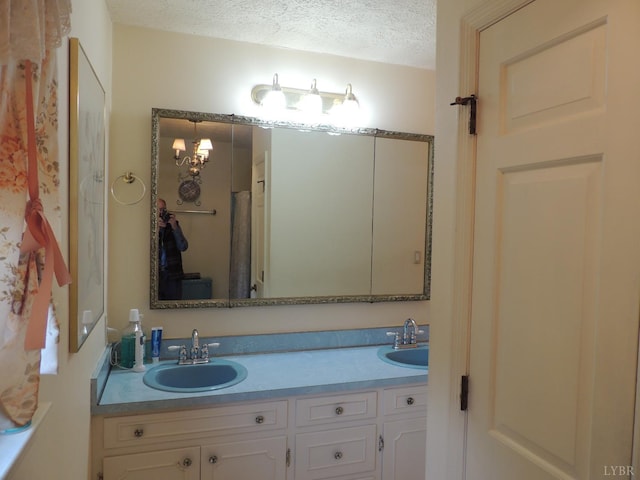 723 Custer Dr, Lynchburg, VA 24502 - full bath with double vanity, a sink, and a textured ceiling