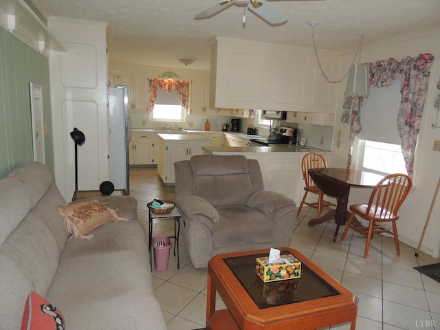 723 Custer Dr, Lynchburg, VA 24502 - living room with a textured ceiling, a ceiling fan, and light tile patterned floors