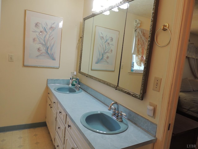 723 Custer Dr, Lynchburg, VA 24502 - full bathroom with double vanity, baseboards, and a sink