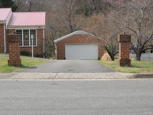 723 Custer Dr, Lynchburg, VA 24502 - view of front of home featuring metal roof, brick siding, and aphalt driveway