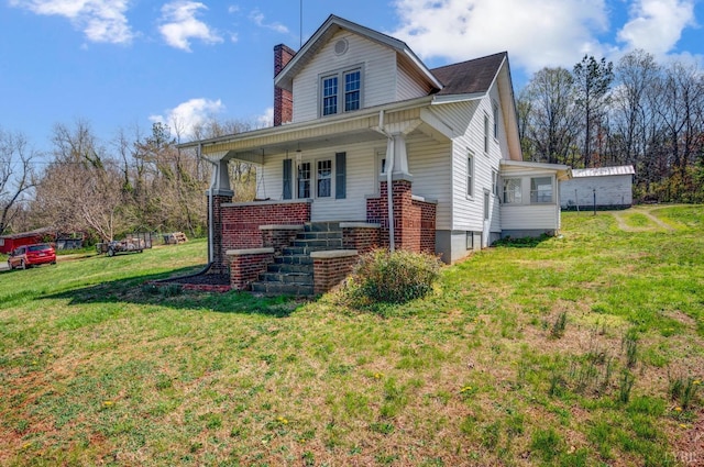501 W Spencer Rd, Hurt, VA 24563 - view of front of property featuring a chimney, a front yard, covered porch, stairs, and brick siding