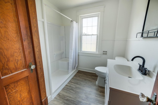 501 W Spencer Rd, Hurt, VA 24563 - bathroom featuring toilet, baseboards, a shower with curtain, and wood finished floors
