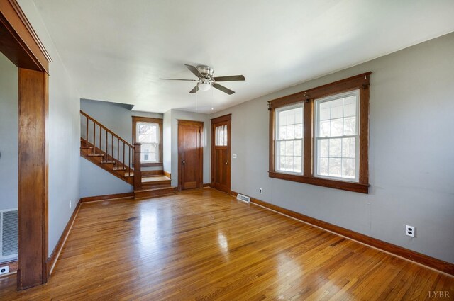 501 W Spencer Rd, Hurt, VA 24563 - entryway with baseboards, stairs, wood finished floors, and a ceiling fan