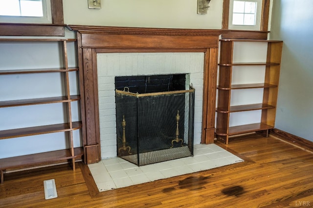 501 W Spencer Rd, Hurt, VA 24563 - detailed view of wood finished floors, a fireplace, and baseboards