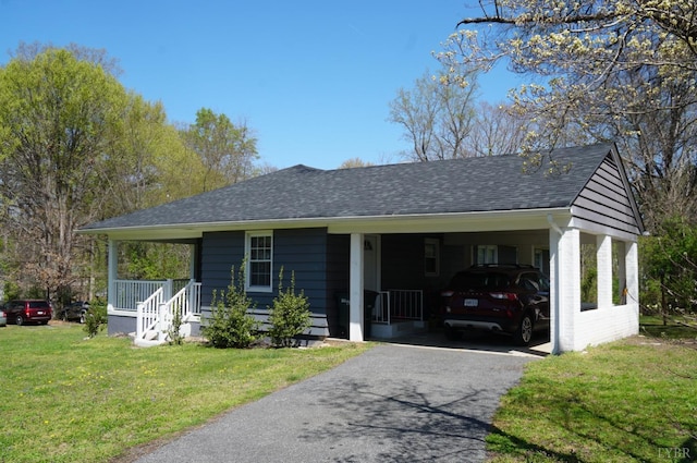 203 Marshall St, Brookneal, VA 24528 - view of front of home with driveway, roof with shingles, a front yard, and a carport