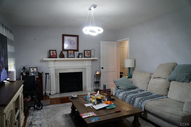 203 Marshall St, Brookneal, VA 24528 - living room featuring wood finished floors, a high end fireplace, and a chandelier