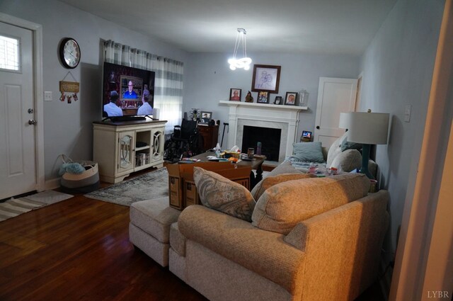 203 Marshall St, Brookneal, VA 24528 - living area with wood finished floors, a fireplace, and baseboards