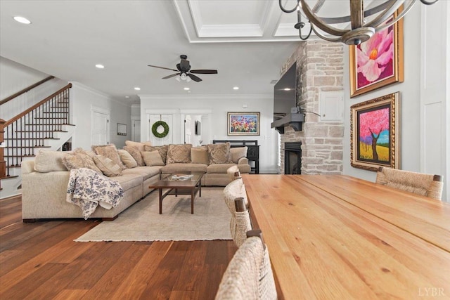 1031 Tori Ct, Forest, VA 24551 - living area with ornamental molding, dark wood-style flooring, a stone fireplace, a ceiling fan, and stairs