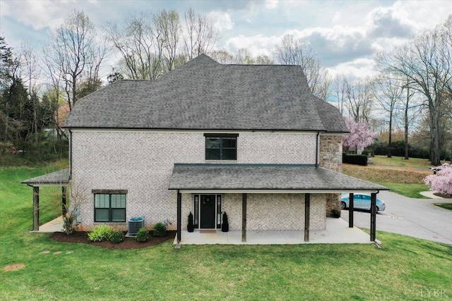 1031 Tori Ct, Forest, VA 24551 - back of property with a patio area, cooling unit, a yard, and roof with shingles