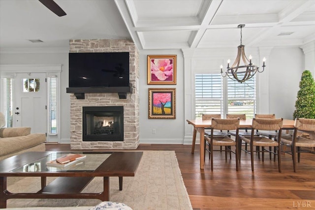1031 Tori Ct, Forest, VA 24551 - living room featuring dark wood-type flooring, a fireplace, a chandelier, beam ceiling, and crown molding