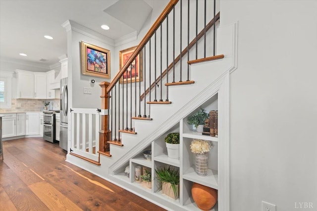 1031 Tori Ct, Forest, VA 24551 - stairway featuring wood finished floors, crown molding, and recessed lighting