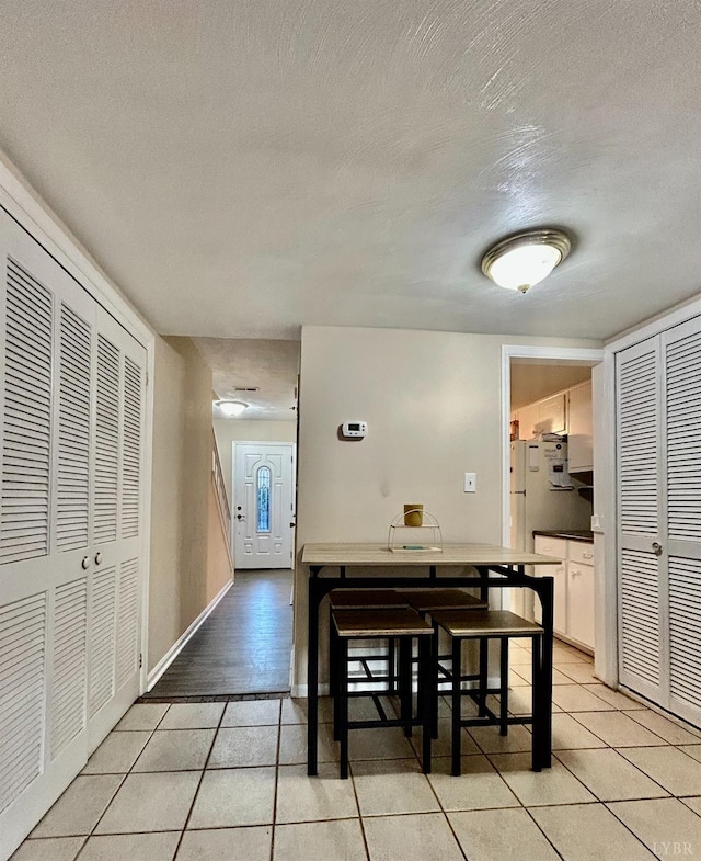 3101 Link Rd Unit 36, Lynchburg, VA 24503 - dining room featuring light tile patterned floors, a textured ceiling, and baseboards