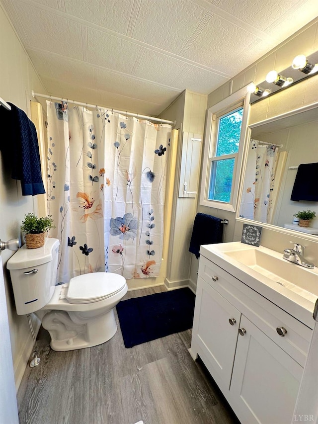 157 Phelps Rd, Madison Heights, VA 24572 - full bath with wood finished floors, vanity, and a shower with shower curtain