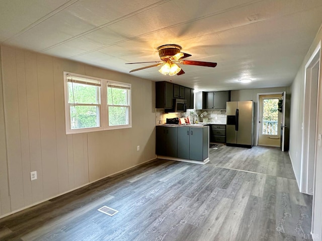 157 Phelps Rd, Madison Heights, VA 24572 - kitchen with stainless steel appliances, wood finished floors, tasteful backsplash, and ceiling fan