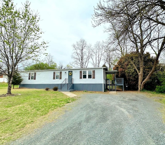 157 Phelps Rd, Madison Heights, VA 24572 - manufactured / mobile home with gravel driveway and a front yard