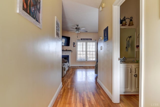 84 Jeter Ct, Lynchburg, VA 24501 - hall featuring light wood-type flooring, baseboards, and a sink