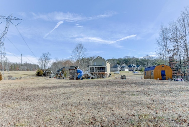 84 Jeter Ct, Lynchburg, VA 24501 - view of yard featuring a storage shed, a playground, and an outbuilding