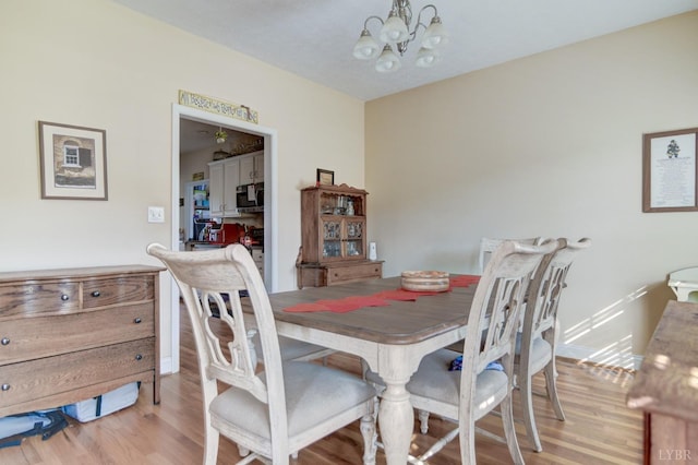 84 Jeter Ct, Lynchburg, VA 24501 - dining area with a chandelier and light wood-type flooring