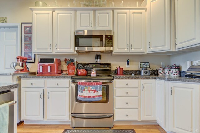 84 Jeter Ct, Lynchburg, VA 24501 - kitchen featuring stainless steel appliances, white cabinets, and light wood-style floors