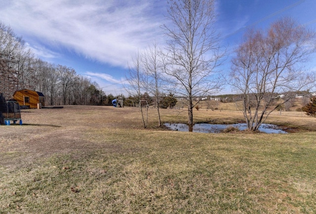 84 Jeter Ct, Lynchburg, VA 24501 - view of green lawn featuring an outbuilding, a storage shed, and a water view