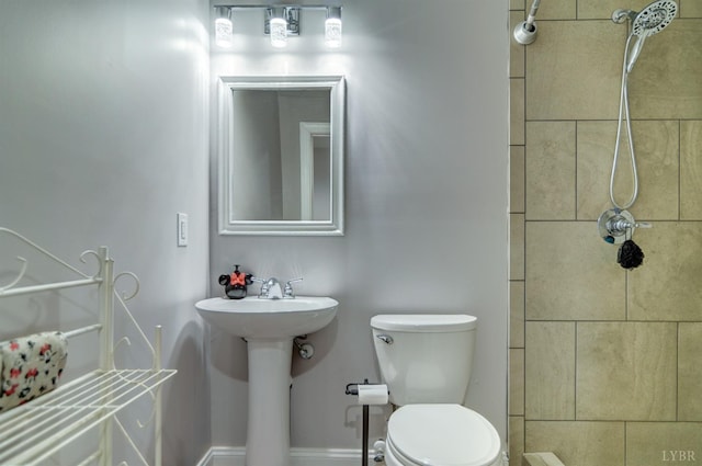 84 Jeter Ct, Lynchburg, VA 24501 - bathroom featuring toilet, tiled shower, and a sink