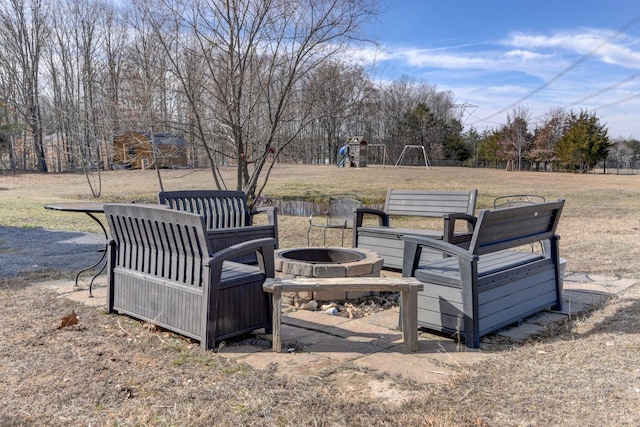 84 Jeter Ct, Lynchburg, VA 24501 - view of patio / terrace with an outdoor fire pit, a playground, and view of scattered trees
