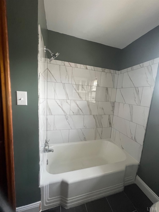 full bath with baseboards, shower / tub combination, and tile patterned floors