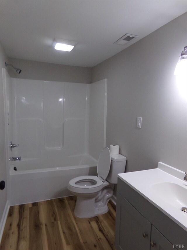 1021 Bowman Ln, Bedford, VA 24523 - full bath with wood finished floors, toilet, vanity, and shower / bathtub combination