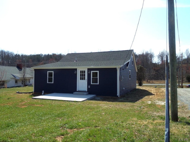 1021 Bowman Ln, Bedford, VA 24523 - back of house featuring a patio, a lawn, and roof with shingles