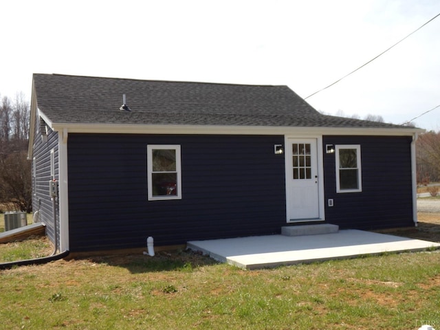 1021 Bowman Ln, Bedford, VA 24523 - rear view of house featuring central AC, a yard, and roof with shingles