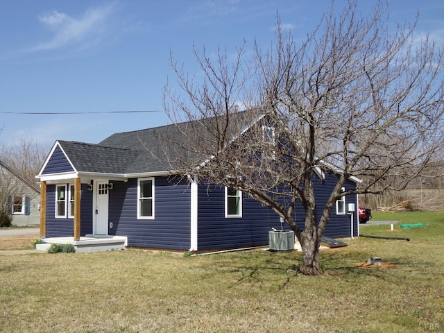1021 Bowman Ln, Bedford, VA 24523 - bungalow with roof with shingles, a front lawn, and cooling unit