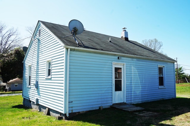 272 Jasper Wood Rd, Hurt, VA 24563 - back of house with a yard, roof with shingles, and a chimney